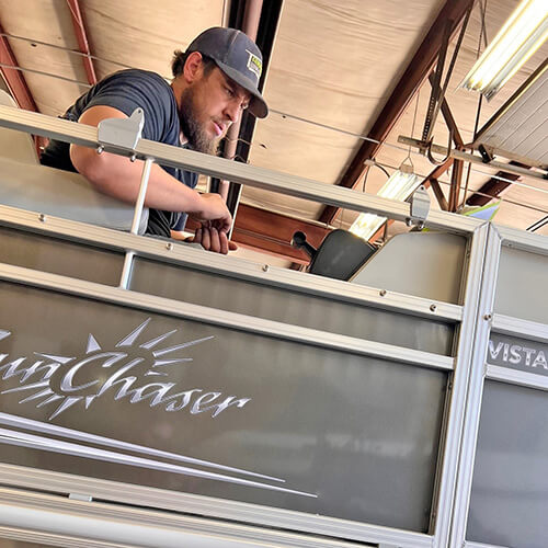 service technician working on a boat