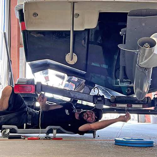 service technician working on a boat